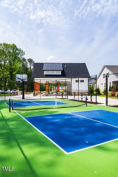 view of tennis court with fence