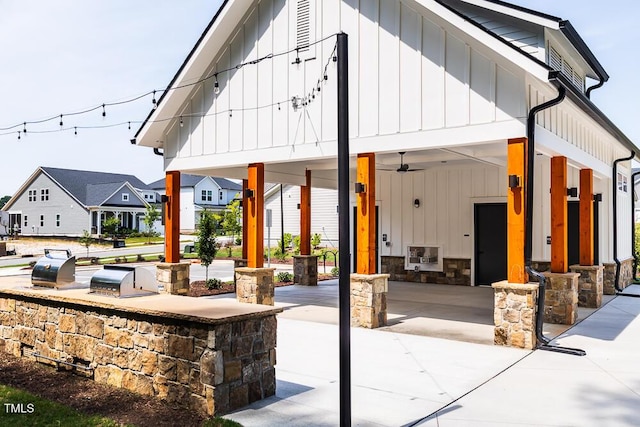 view of patio featuring ceiling fan and a porch