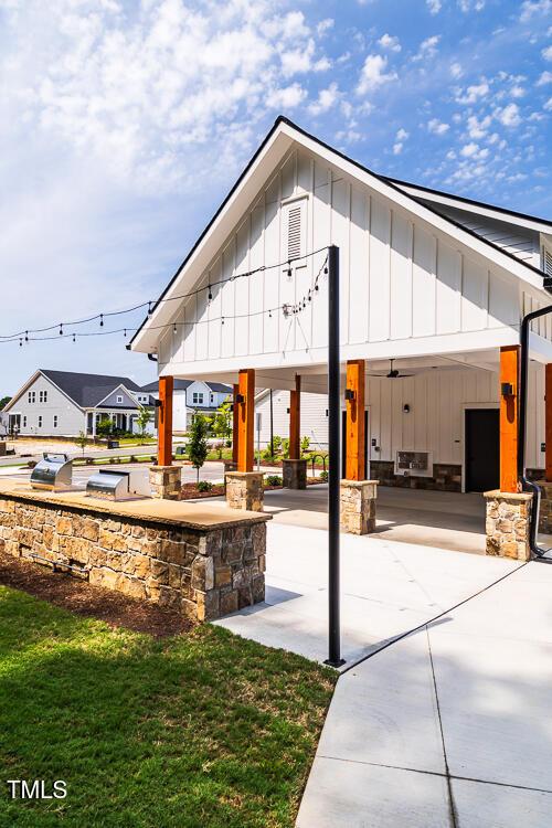 view of home's community with concrete driveway and a gazebo