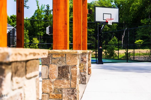 view of basketball court featuring community basketball court and fence