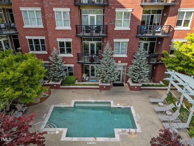 rear view of property featuring brick siding