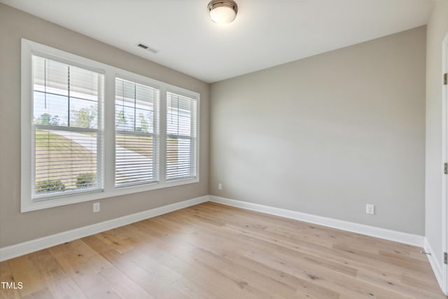 9220 Yardley Town Dr, Wake Forest, NC 27587 - unfurnished room featuring visible vents, baseboards, and light wood-style floors