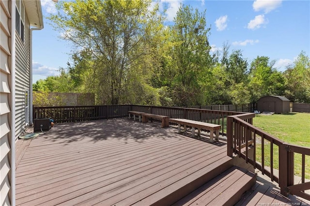 4016 Baywood Point Dr, Fayetteville, NC 28312 - wooden deck featuring a fenced backyard, an outdoor structure, a lawn, and a shed