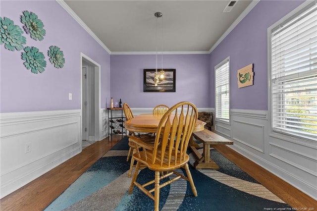 4016 Baywood Point Dr, Fayetteville, NC 28312 - dining area featuring ornamental molding, visible vents, wainscoting, and wood finished floors