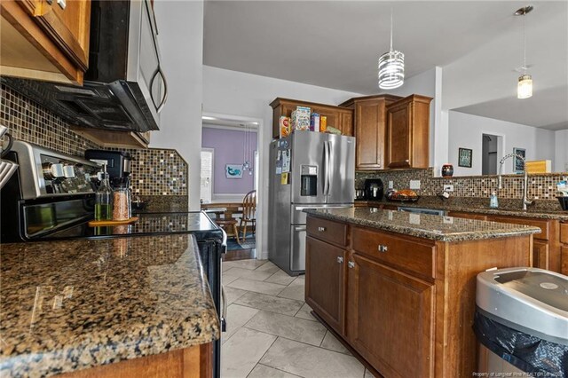 4016 Baywood Point Dr, Fayetteville, NC 28312 - kitchen with tasteful backsplash, hanging light fixtures, dark stone countertops, stainless steel refrigerator with ice dispenser, and black range with electric stovetop