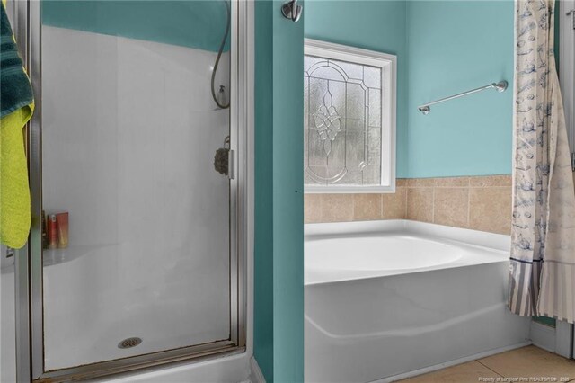 4016 Baywood Point Dr, Fayetteville, NC 28312 - bathroom featuring tile patterned floors, a stall shower, and a garden tub