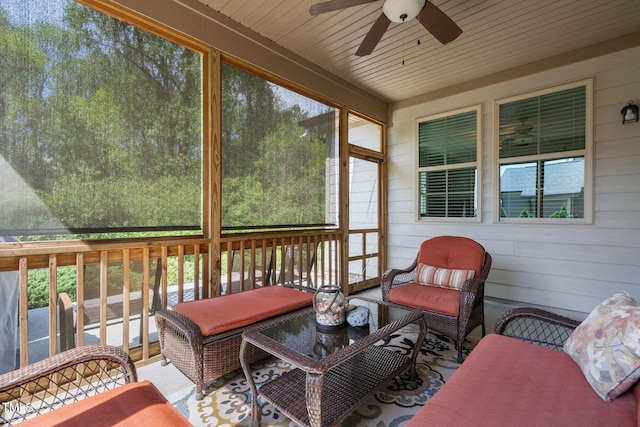 sunroom / solarium with ceiling fan and an outdoor hangout area