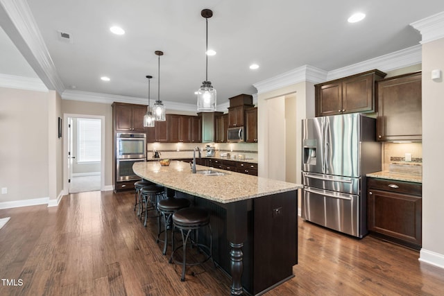 kitchen featuring a sink, stainless steel appliances, visible vents, backsplash, and dark brown cabinets