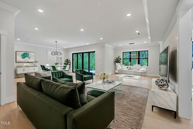3832 Noremac Dr, Raleigh, NC 27612 - living room with healthy amount of natural light, recessed lighting, ornamental molding, light wood-style flooring, and baseboards