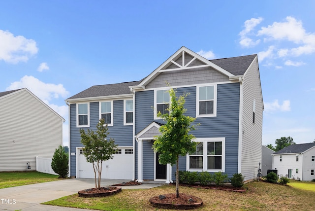 1004 Summer Mist Ln, Durham, NC 27704 - view of front of home with an attached garage, concrete driveway, and a front yard
