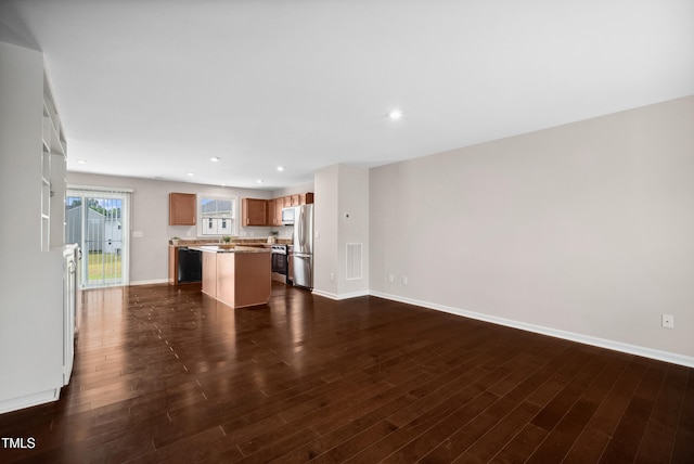 1004 Summer Mist Ln, Durham, NC 27704 - unfurnished living room featuring dark wood-style floors and recessed lighting