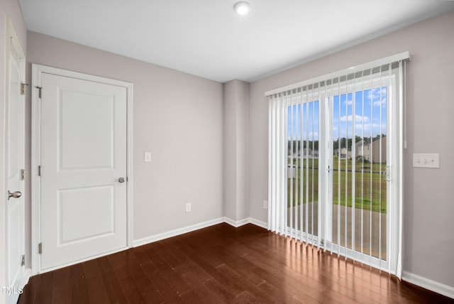 1004 Summer Mist Ln, Durham, NC 27704 - spare room with dark wood finished floors and baseboards