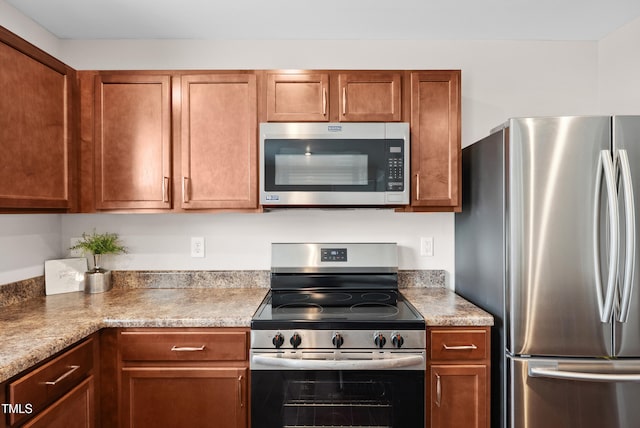 1004 Summer Mist Ln, Durham, NC 27704 - kitchen with appliances with stainless steel finishes, brown cabinetry, and light countertops