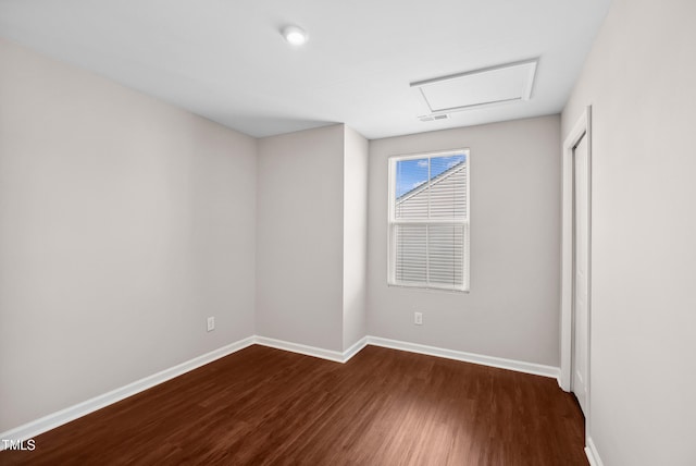1004 Summer Mist Ln, Durham, NC 27704 - empty room with attic access and dark wood-style floors