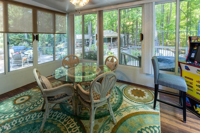 sunroom / solarium featuring wood finished floors