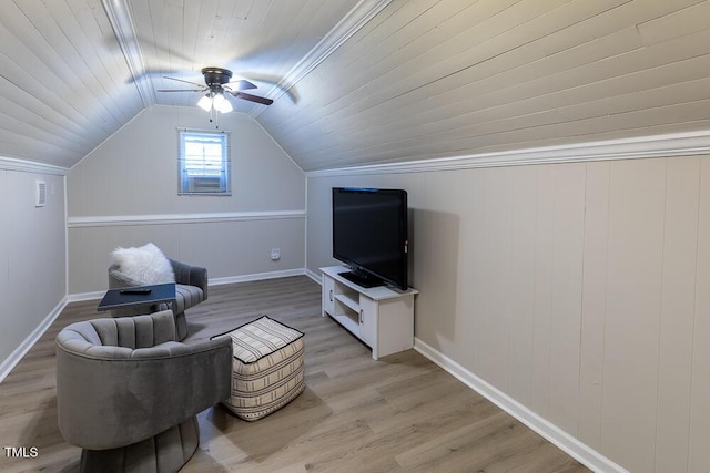 living area featuring baseboards, light wood-style flooring, ceiling fan, and lofted ceiling