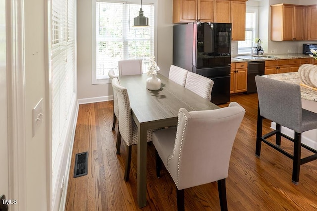 5129 Bartons Enclave Ln, Raleigh, NC 27613 - dining space with wood finished floors and baseboards