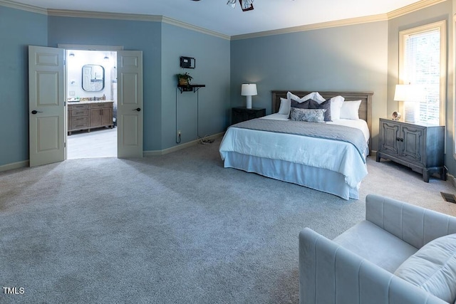 5129 Bartons Enclave Ln, Raleigh, NC 27613 - bedroom with crown molding, baseboards, light carpet, and ensuite bathroom