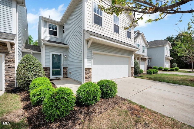 108 Princess Pl, Morrisville, NC 27560 - view of front of home with an attached garage, stone siding, and concrete driveway