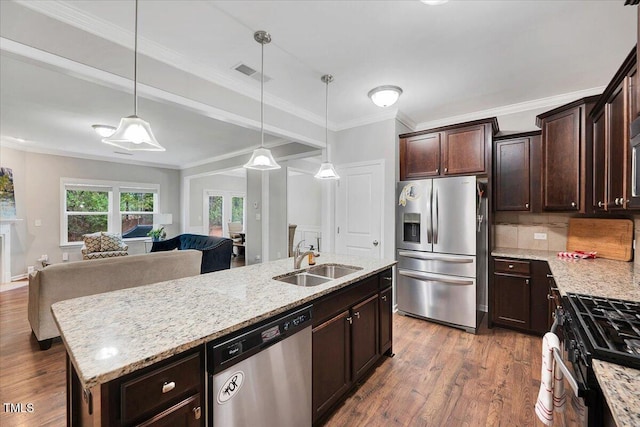 108 Princess Pl, Morrisville, NC 27560 - kitchen featuring a sink, open floor plan, appliances with stainless steel finishes, and wood finished floors