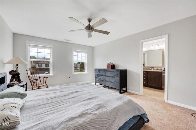 108 Princess Pl, Morrisville, NC 27560 - bedroom featuring light carpet, ensuite bath, baseboards, and a ceiling fan