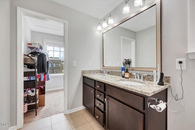 108 Princess Pl, Morrisville, NC 27560 - bathroom featuring a sink, tile patterned floors, baseboards, and double vanity