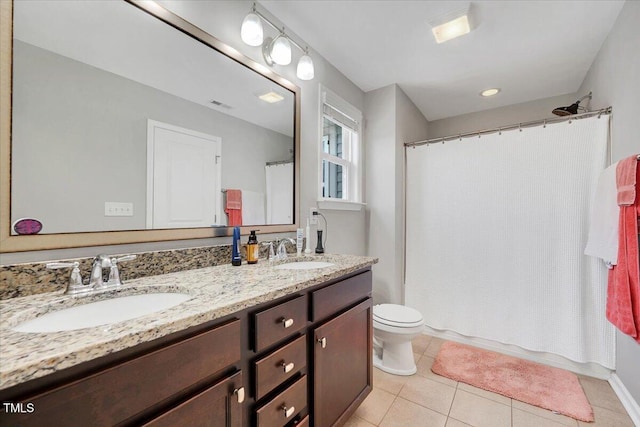 108 Princess Pl, Morrisville, NC 27560 - full bathroom with toilet, tile patterned floors, double vanity, and a sink