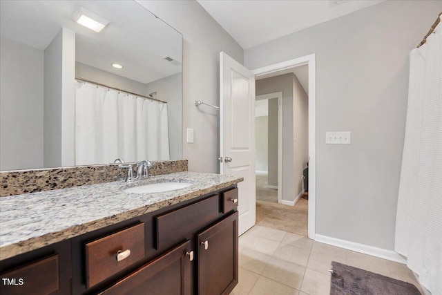 108 Princess Pl, Morrisville, NC 27560 - full bathroom with visible vents, baseboards, vanity, and tile patterned floors
