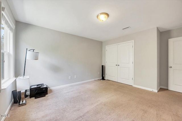 108 Princess Pl, Morrisville, NC 27560 - unfurnished bedroom with a closet, visible vents, baseboards, and carpet