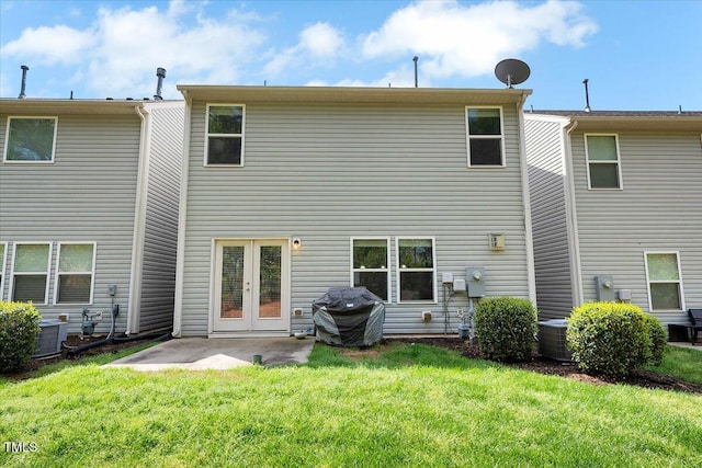 108 Princess Pl, Morrisville, NC 27560 - rear view of house with a yard, central air condition unit, french doors, and a patio