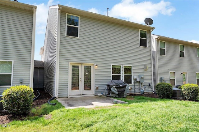 108 Princess Pl, Morrisville, NC 27560 - rear view of house featuring french doors, a yard, a patio area, and central AC unit