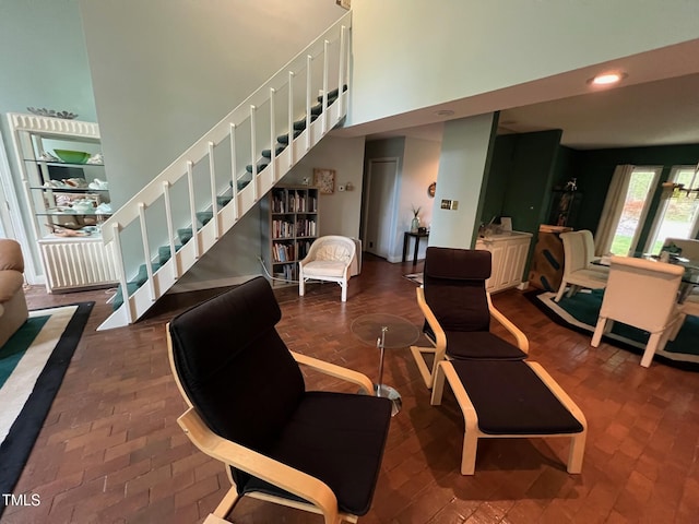 106 Orchard Rd, Henderson, NC 27536 - community lobby featuring a high ceiling, stairs, and recessed lighting