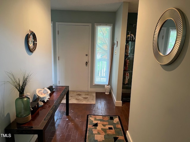 106 Orchard Rd, Henderson, NC 27536 - entryway with healthy amount of natural light, hardwood / wood-style floors, and baseboards