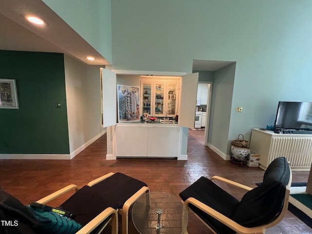 106 Orchard Rd, Henderson, NC 27536 - living area with a high ceiling, baseboards, and recessed lighting