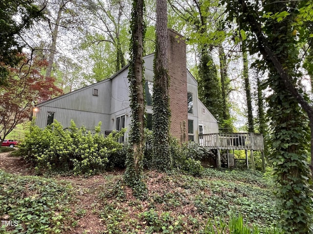 106 Orchard Rd, Henderson, NC 27536 - view of side of property featuring a wooden deck