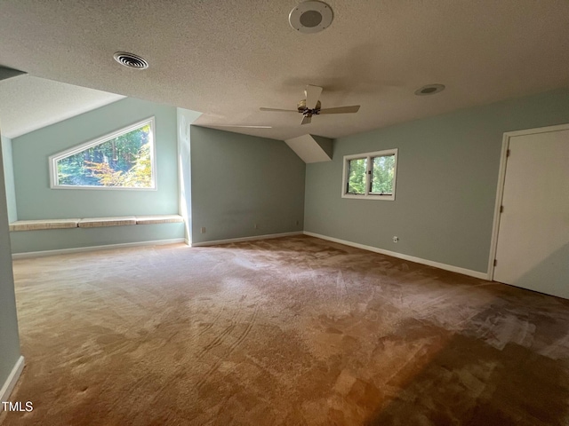 106 Orchard Rd, Henderson, NC 27536 - bonus room with carpet floors, vaulted ceiling, ceiling fan, baseboards, and a textured ceiling