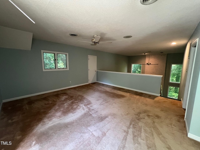 106 Orchard Rd, Henderson, NC 27536 - spare room with baseboards, carpet floors, a ceiling fan, and a textured ceiling