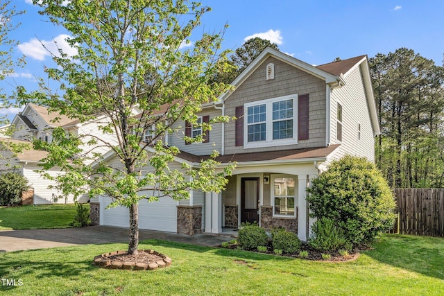 view of front facade featuring concrete driveway, stone siding, a front lawn, a garage, and fence