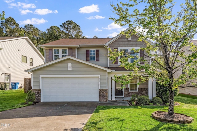 view of front facade with a garage, a front yard, driveway, and stone siding