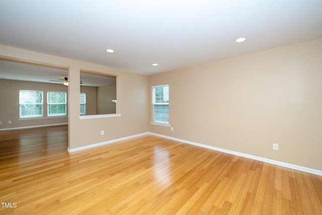 unfurnished room featuring light wood-style flooring, recessed lighting, ceiling fan, and baseboards