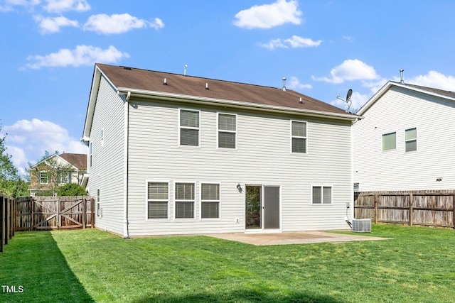 rear view of property with a patio, a fenced backyard, a gate, and a lawn
