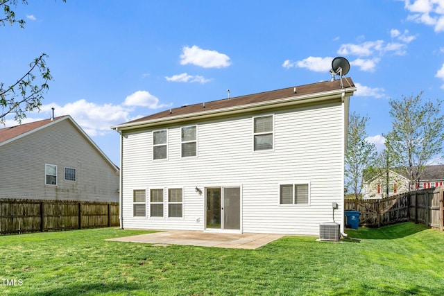 rear view of house with a patio area, a fenced backyard, central AC unit, and a lawn