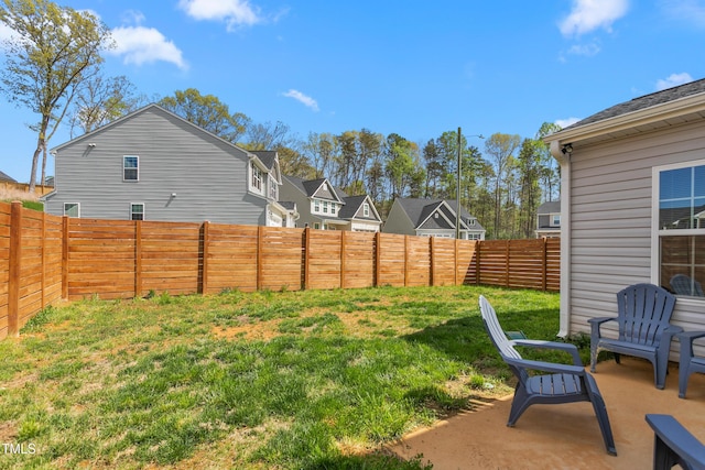view of yard with a fenced backyard and a patio area