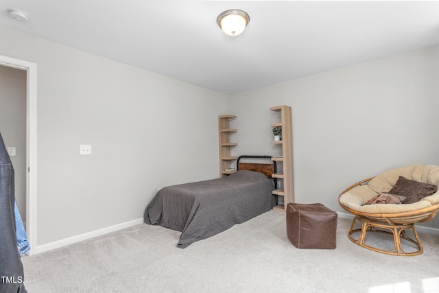 carpeted bedroom featuring baseboards