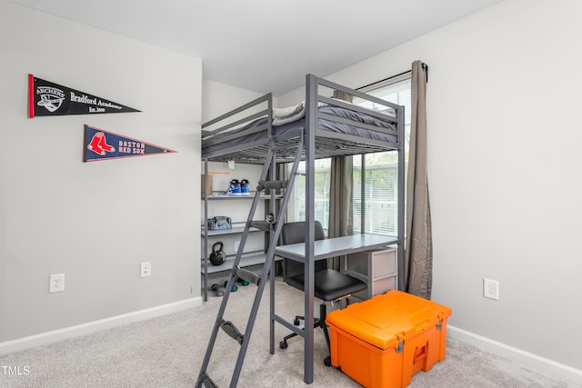 carpeted bedroom with baseboards
