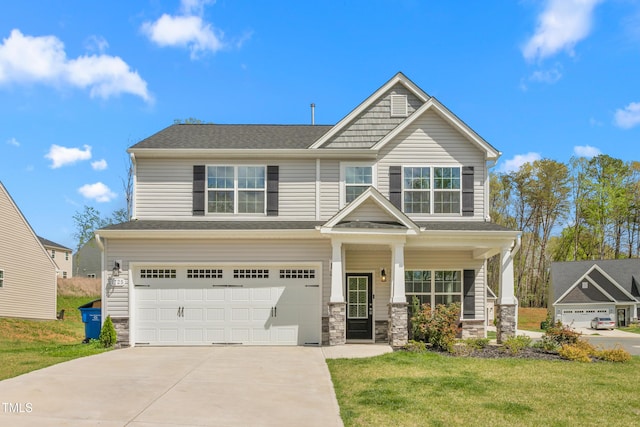 craftsman inspired home featuring a garage, a front yard, stone siding, a shingled roof, and concrete driveway