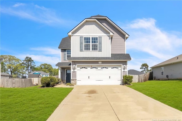 view of front of house featuring concrete driveway, board and batten siding, a front yard, a garage, and fence