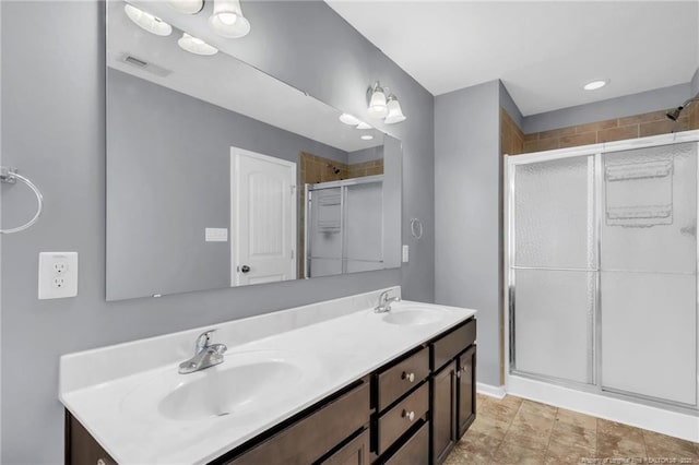 full bathroom featuring a sink and a stall shower