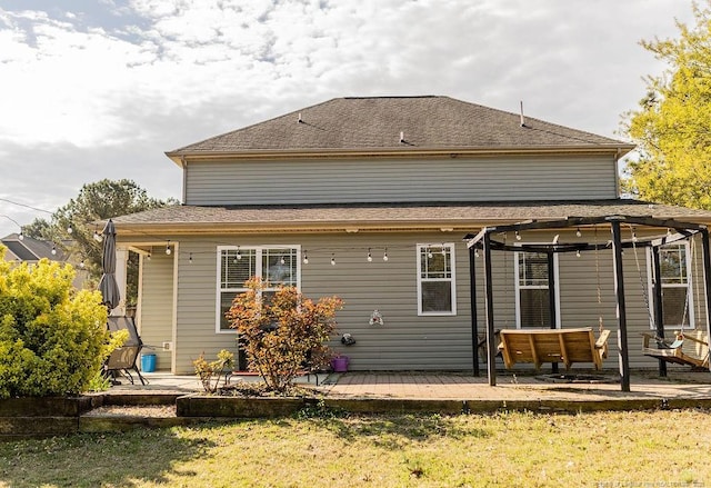 186 Kentucky Derby Ln, Lillington, NC 27546 - rear view of house featuring a deck, a patio, and a lawn