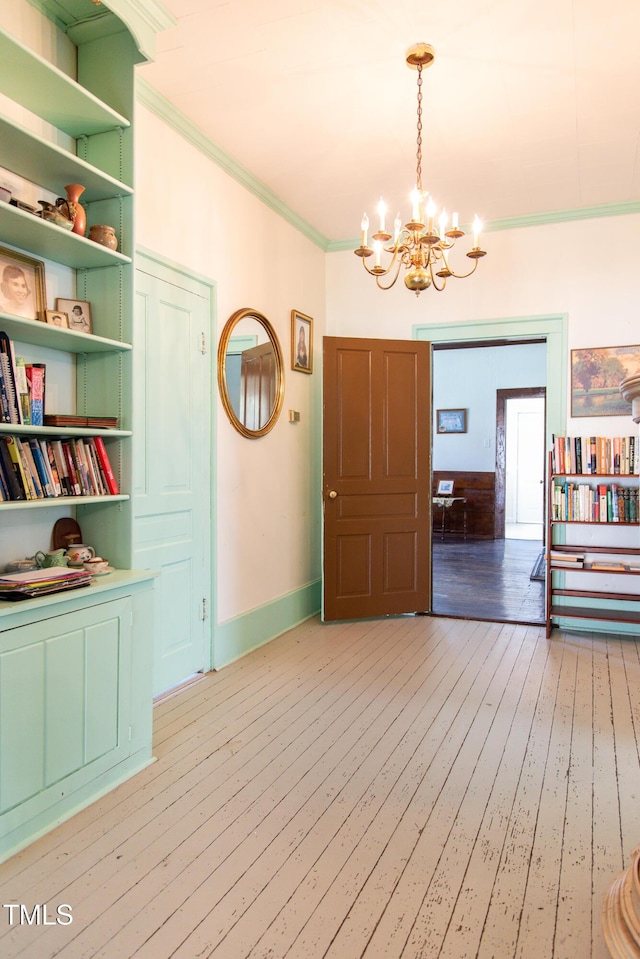 1556 Pleasants Rd, Wendell, NC 27591 - interior space with ornamental molding, baseboards, an inviting chandelier, and light wood-style floors